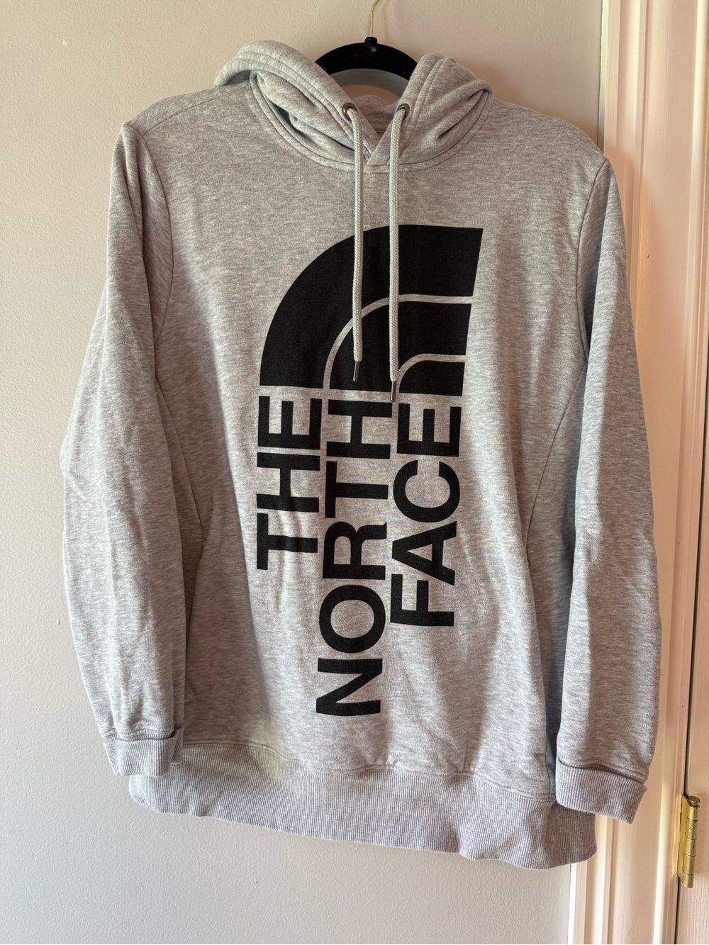 The North Face Light Gray Hoodie with Black Vertical Logo
